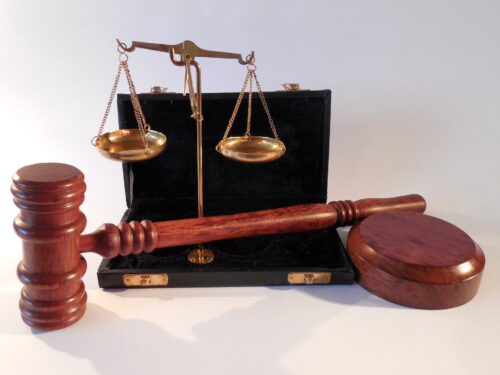 gavel next to brief case