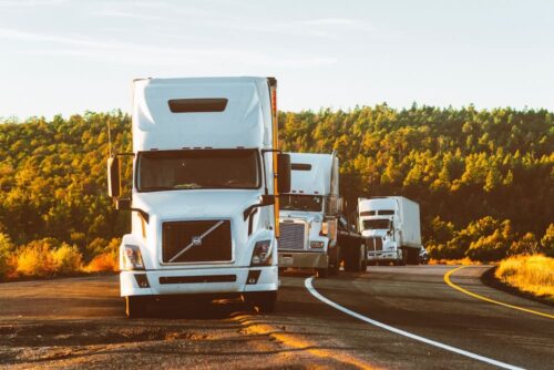 trucks on side of road