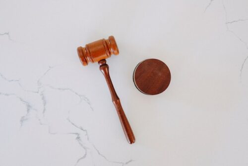 brown gavel on marble background