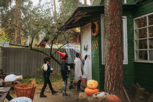 children in costumes trick or treating