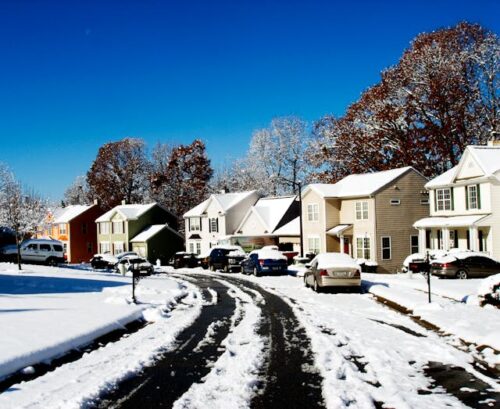 snowy sidewalks in suburban neighborhood