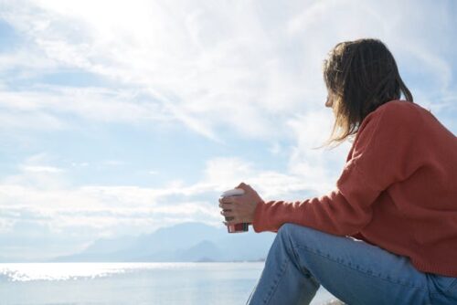 solemn woman sitting alone